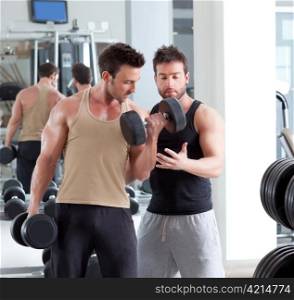 gym personal trainer man with weight training equipment