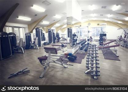 Gym with fitness equipment for training. Gym with fitness equipment