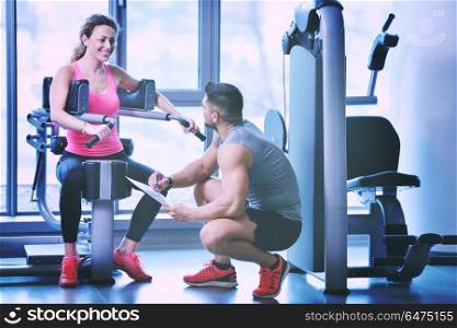 Gym woman exercising with her personal trainer. woman exercising with her personal trainer