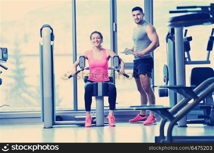 Gym woman exercising with her personal trainer. woman exercising with her personal trainer