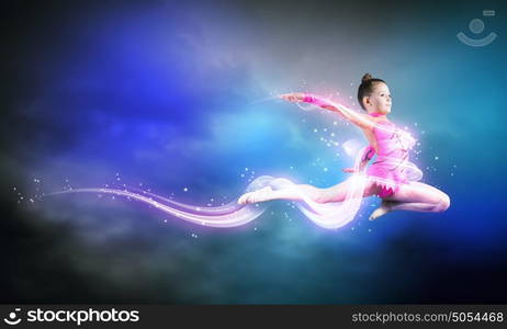 Gymnast girl. Little cute girl gymnast making high jump