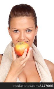 Gymnastics girl with a towel eating apple isolated on white background