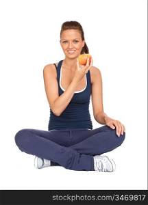 Gymnastics girl with an apple sitting with cross-legs on white background