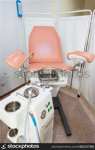 Gynecological cabinet with chair and other medical equipment in modern clinic. Gynecological cabinet in modern clinic