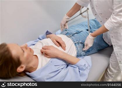 Gynecologist doctor measuring female patient hip volume during checkup at prenatal medical center. Gynecologist doctor measuring female patient hip volume during checkup