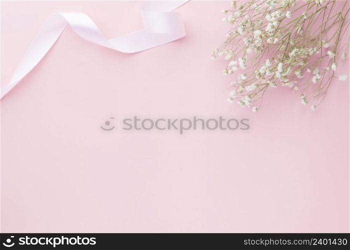 Gypsophila flowers on pink pastel background, Minimalism, Spring flower blosssom concept, Flat lay, top view, copy space
