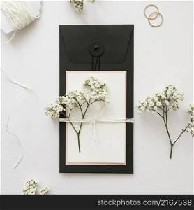 gypsophila greeting card tied with strings white backdrop