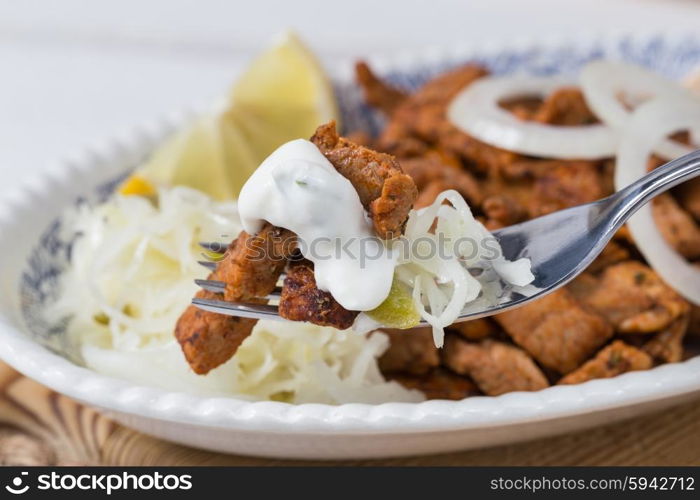 Gyros with Tzatziki Coleslaw olives and feta cheese. Gyros with Tzatziki Coleslaw olives and feta cheese.