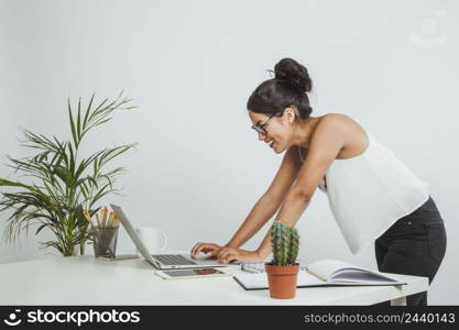 haapy businesswoman looking her laptop