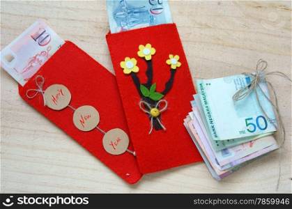 Habit, custom of Vietnamese on Tet is lucky money, a Vietnam traditional culture, child wish somebody a happy new year, receive red envelope with new small change, Tet on spring, also lunar new year