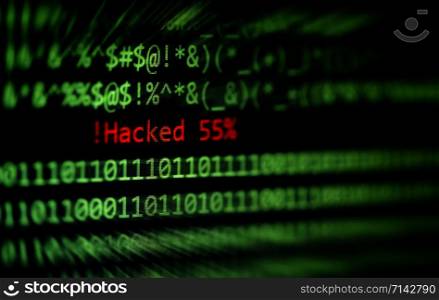 Hacked computer technology binary code number data alert ! Hacked 55% on display screen / Criminals internet activity or cyber thief security hacking concept - selective focus