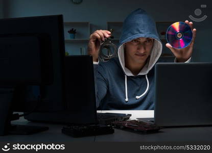 Hacker hacking computer at night