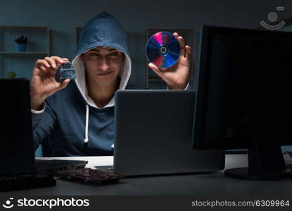 Hacker hacking computer at night