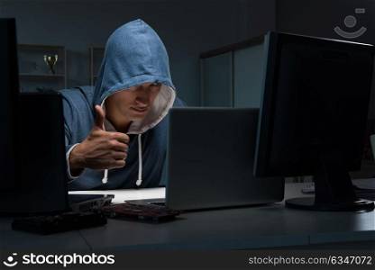 Hacker hacking computer at night