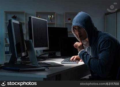 Hacker hacking computer at night. The hacker hacking computer at night
