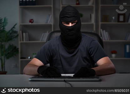 Hacker hacking computer late at night