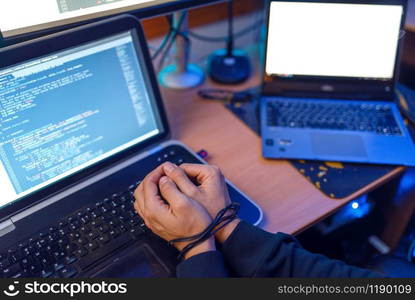 Hacker hands tied with wires, darknet using concept, information crime. Internet spy, crime lifestyle, risk job, network criminal. Hacker hands tied with wires, crime lifestyle