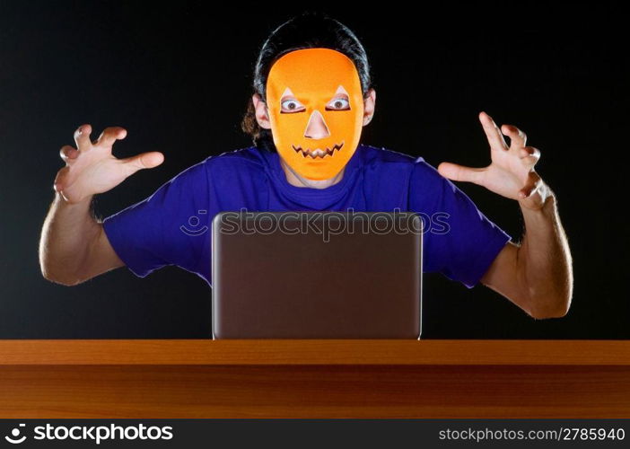 Hacker sitting in dark room