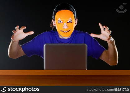 Hacker sitting in dark room