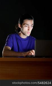 Hacker sitting in dark room