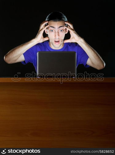 Hacker sitting in dark room