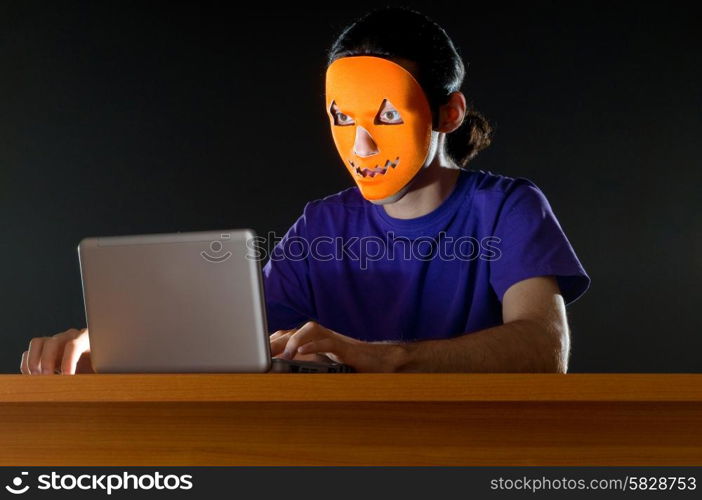 Hacker sitting in dark room