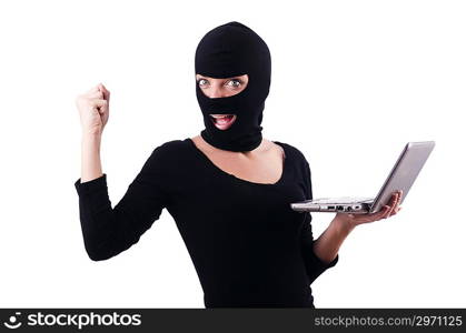 Hacker with computer wearing balaclava