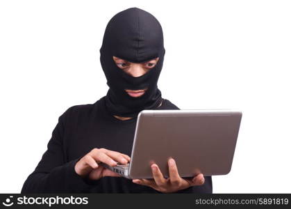 Hacker with computer wearing balaclava