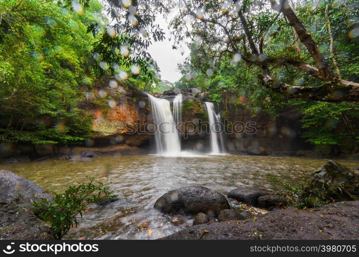 Haew Suwat Waterfall with falling rain in Khao Yai National Park, Thailand