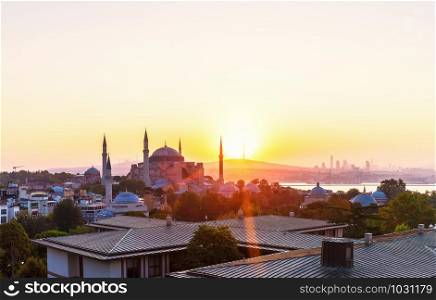 Hagia Sophia and Istanbul roofs at sunrise, beautiful view.. Hagia Sophia and Istanbul roofs at sunrise, beautiful view