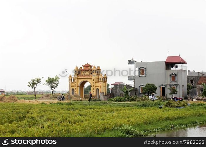 HAI DUONG, VIETNAM, JULY 30: Gate in vietnamese rural village on july, 30, 2014 in Hai Duong, Vietnam. This is special characteristics of rural Vietnam