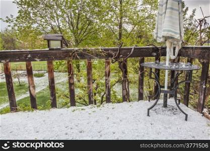 hailstones covering patio and backyard after violent spring storm