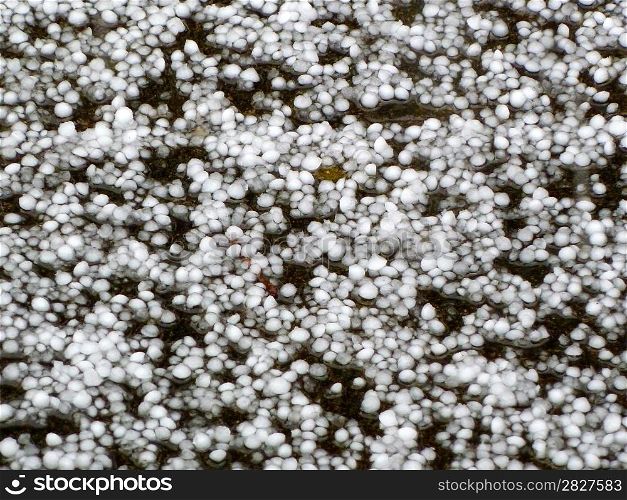 hailstones on the ground as a background