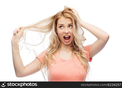 hair care, hairstyle and people concept - young woman or teenage girl holding strand of her hair