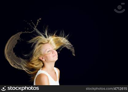 Hair care. Young attractive blond woman with hair in splashes
