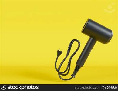 Hair dryer on yellow background with copy space. Empty space for text, advertising. Professional hair style tool. Realistic hairdryer for hairdresser salon or home usage. Tool for drying hair. 3D. Hair dryer on yellow background with copy space. Empty space for text, advertising. Professional hair style tool. Realistic hairdryer for hairdresser salon or home usage. Tool for drying hair. 3D.