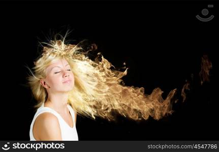 Hair in fire. Young attractive blond girl with hair burning with fire