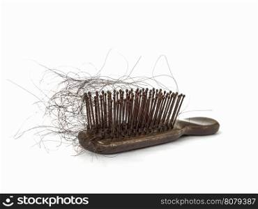 Hair loss stick at a comb isolated over white, hair treatment concept