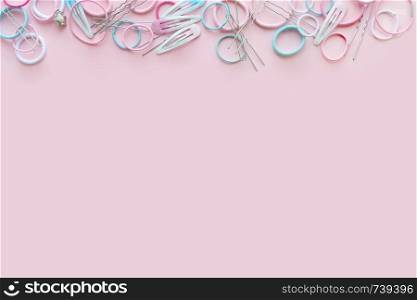 Hair pink scrunchies and hairpins on pink background, beauty concept, flat lay. Hair scrunchies and hairpins on pink background, beauty concept, flat lay
