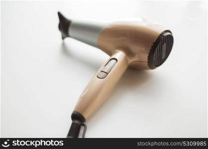 hair tool, beauty and hairdressing concept - hairdryer on white background. hairdryer on white background