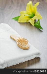 hairbrush and towel with flower