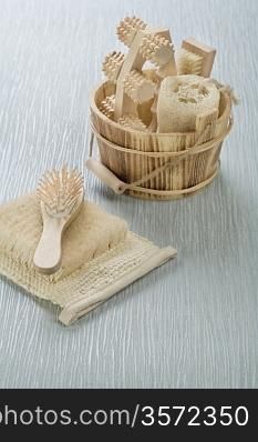 hairbrush on bast with wooden bucket