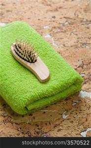 hairbrush on green towel