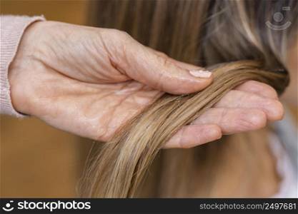 hairdresser holding tuft hair