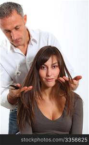 Hairdresser looking for woman&acute;s new haircut