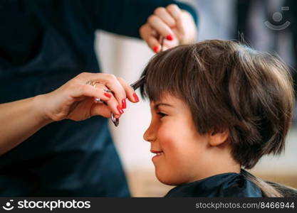 Hairdresser&rsquo;s hands with scissors cutting boys hair in hair salon. Hair Salon, Scissors Cutting Hair, Children