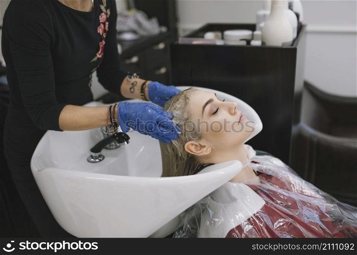 hairdresser taking care client salon