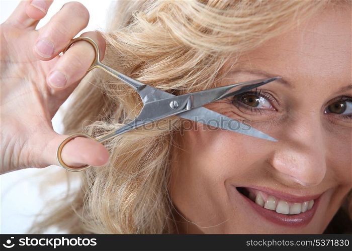 Hairdresser with a pair of scissors