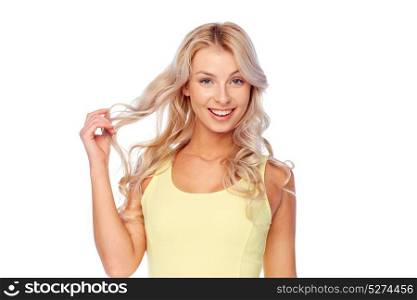 hairstyle and people concept - happy smiling beautiful young woman with blonde hair. happy smiling young woman with blonde hair