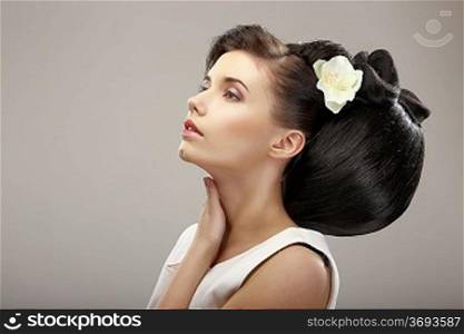 Hairstyle Contemporary Design. Sensual Woman with Creative Coiffure. Glamor